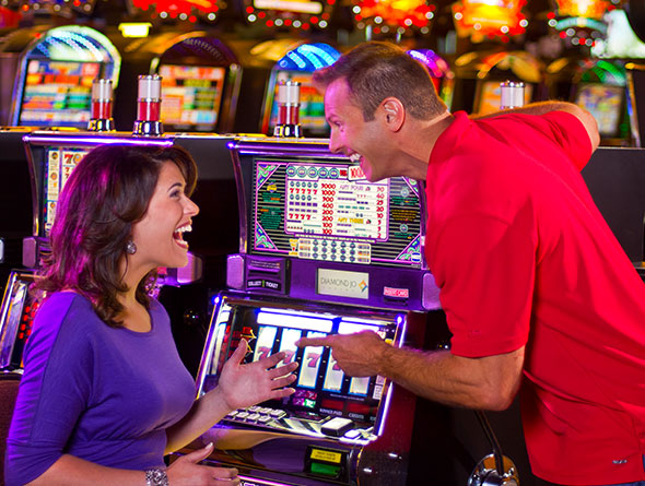 Couple playing slots image