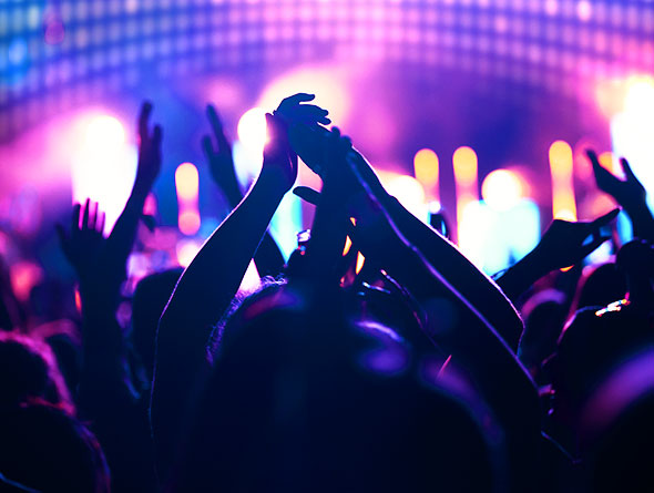 crowd clapping their hands above their heads