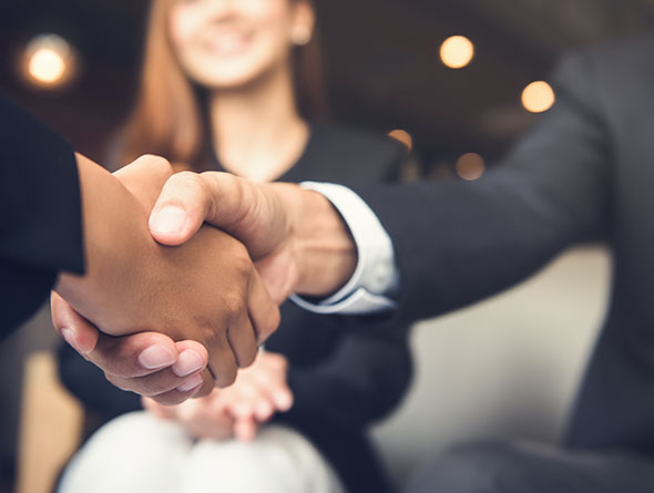 corporate management business leaders shaking hands