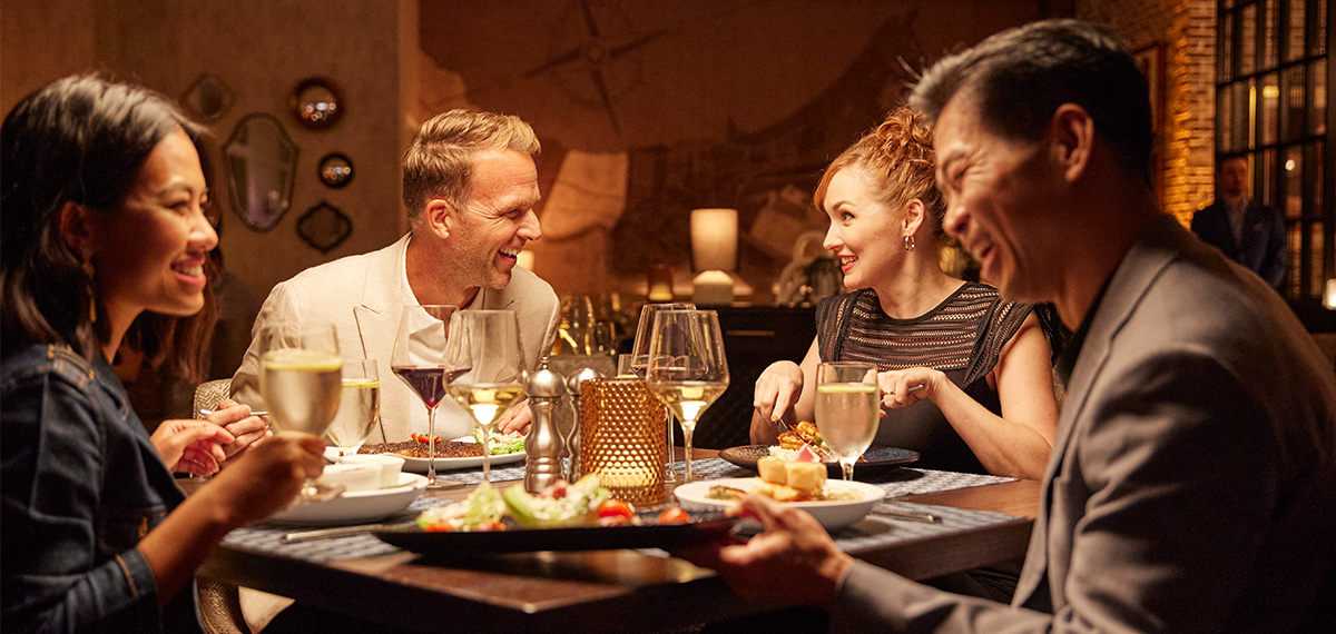 couples eating and drinking at a restaurant