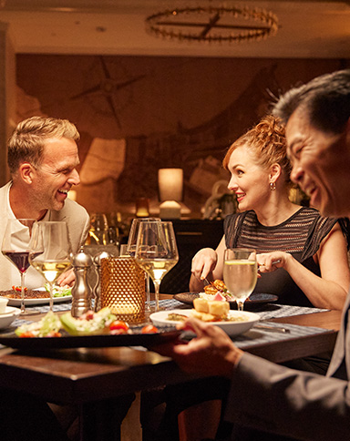 couples eating and drinking at a restaurant