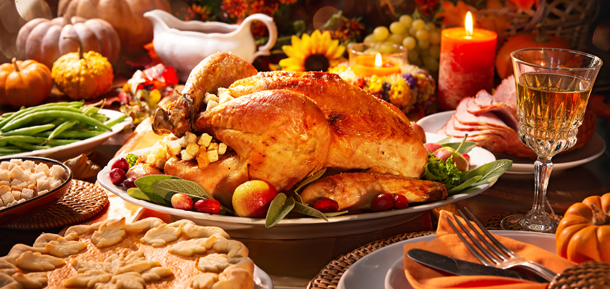 a turkey on a holiday themed table for Thanksgiving dining specials