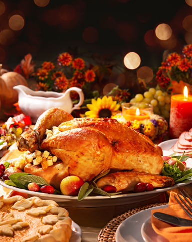 a turkey on a holiday themed table for Thanksgiving dining specials