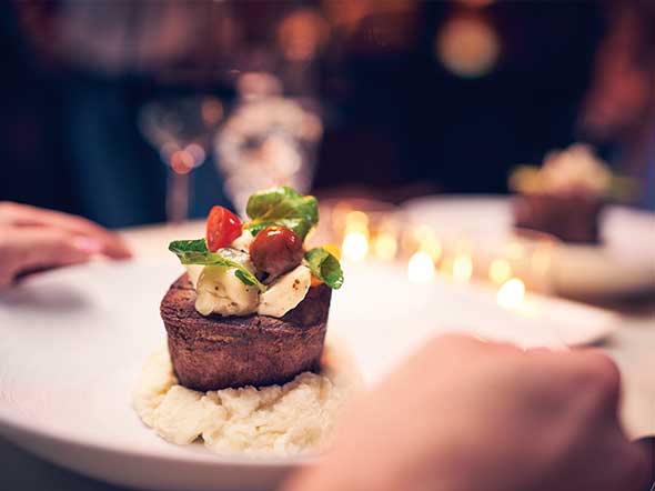 A plated steak at a fine dining restaurant